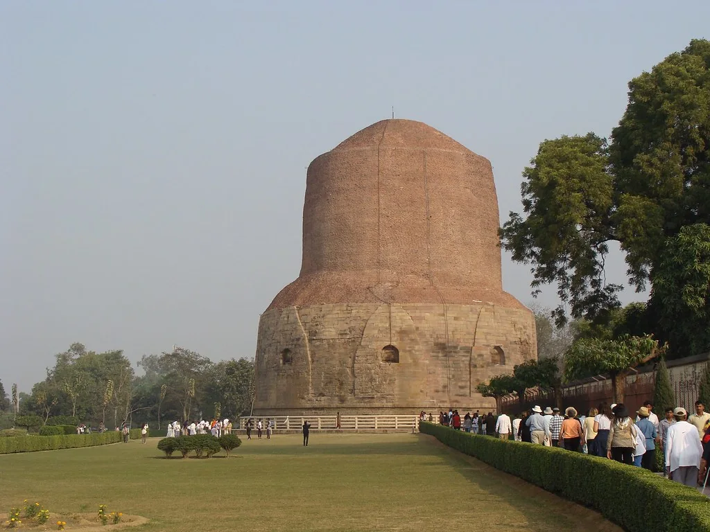 Dhamek Stupa and visiting pilgrims in Sarnath